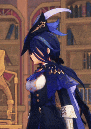 a woman in a witch costume stands in front of a bookshelf