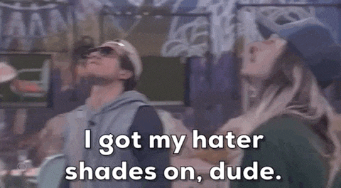 a man wearing sunglasses and a hat is saying i got my hater shades on , dude