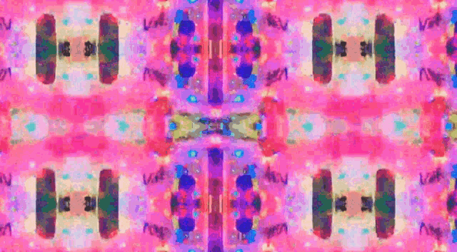 a pink and purple kaleidoscope with the letters v and n on it
