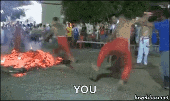 a group of people are dancing in front of a fire with the words " you " written on the bottom