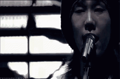 a person is singing into a microphone with the words renegade pierrot written below them