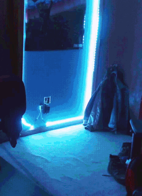 a room with a blue light and a poster on the wall that says ' fortnite ' on it