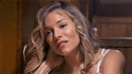 a close up of a woman 's face with blonde hair