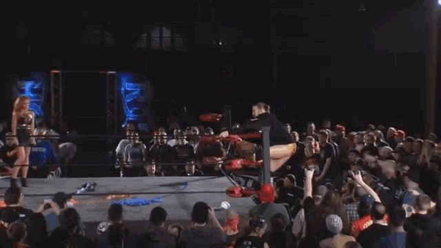 a man in a wrestling ring with the number 23 on the back