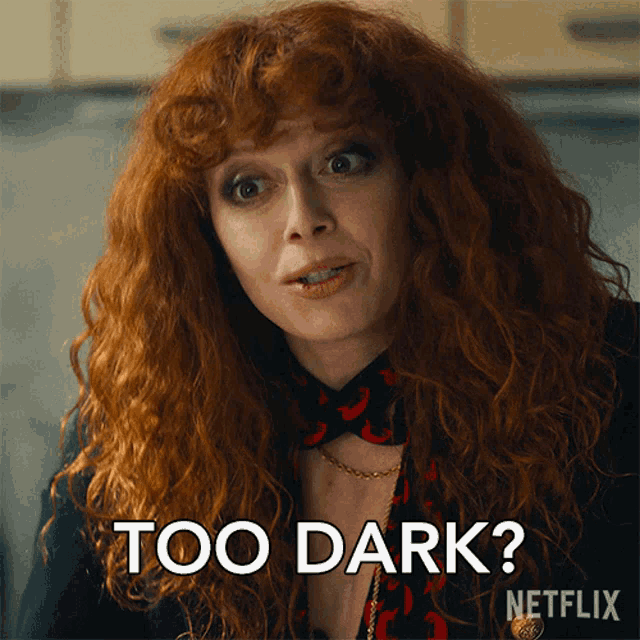 a woman with red hair says " too dark " in a netflix advertisement