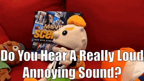 a puppet sitting next to a movie scene magazine