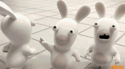 three cartoon rabbits are standing next to each other on a tile floor .