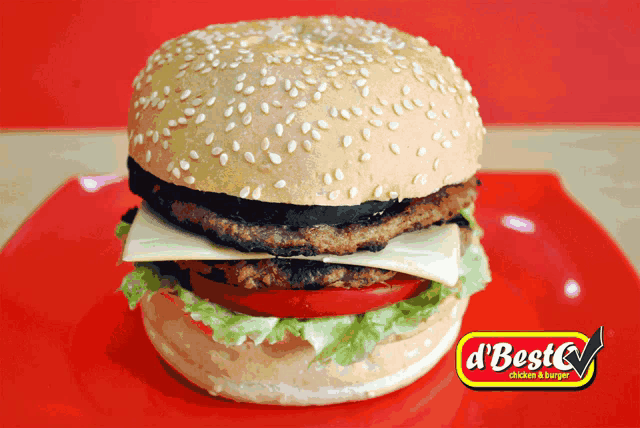 a hamburger with cheese lettuce and tomato on a red plate that says d ' best cream burger