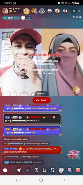 a phone screen shows a man and a woman on a live stream