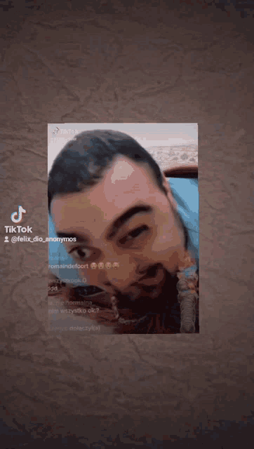 a man 's face is displayed on a tiktok page