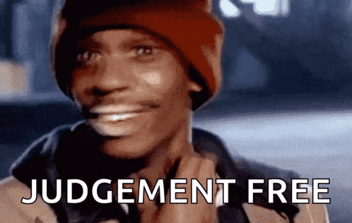 a man wearing a red hat is smiling with the words judgement free written on the bottom