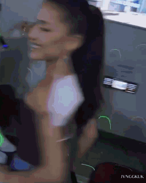 a blurry picture of a woman with the words jvnggkuk on the bottom