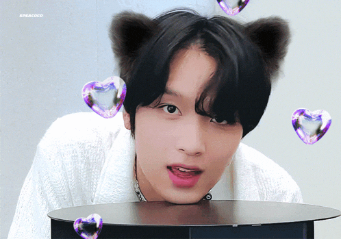 a boy with cat ears and hearts around him