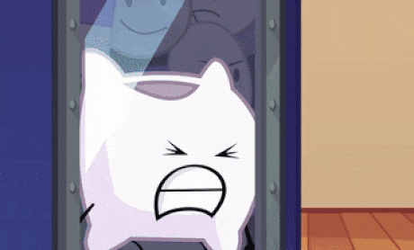 a cartoon character with an angry face is sitting in a safe