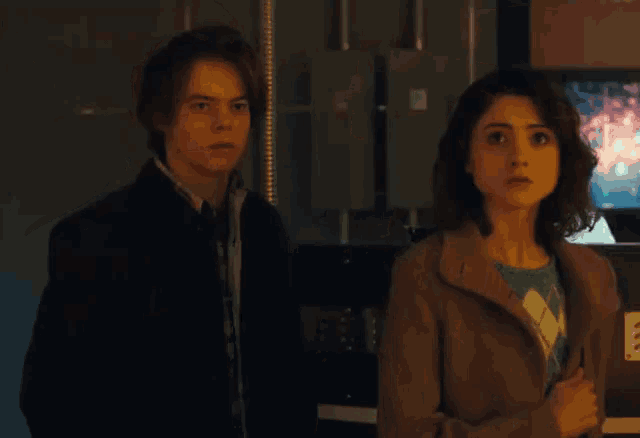 a man and a woman standing next to each other