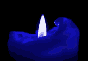 a blue candle with a white flame is lit