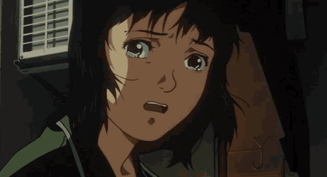 a close up of a girl 's face with tears in her eyes