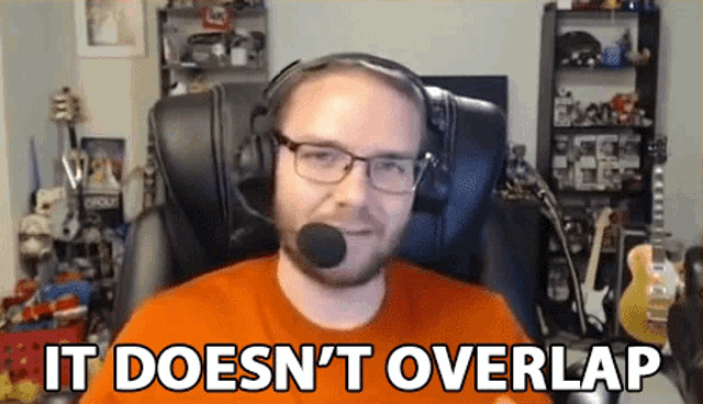 a man wearing headphones and glasses says it does n't overlap while sitting in a chair