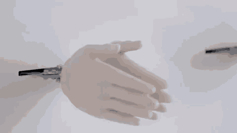a close up of a person 's hands reaching out towards each other on a white background .