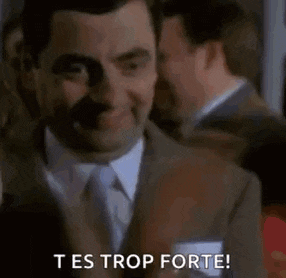 a man in a suit and tie is making a funny face and says `` tes trop forte '' .