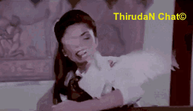 a blurred image of a woman with the words thirudan chat written in yellow