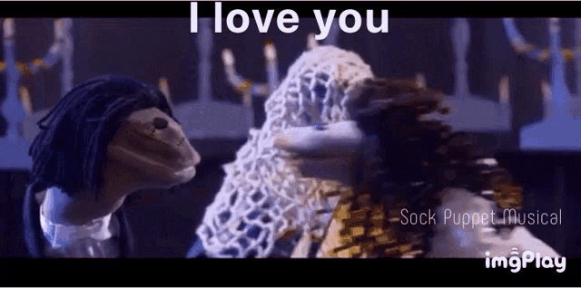 a couple of puppets are standing next to each other with the words i love you written on the bottom