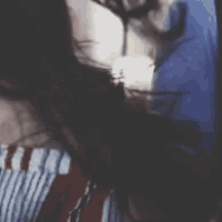 a close up of a woman 's face with long hair
