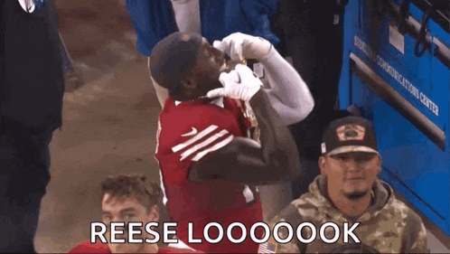 a man in a red jersey with the number 33 on it