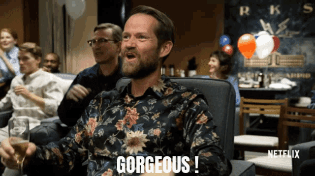 a man in a floral shirt says gorgeous