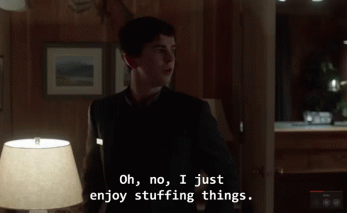 Stuffing Things Bates Motel Norman Funny Smile GIF - Stuffing Things Bates Motel Norman Funny Smile GIFs
