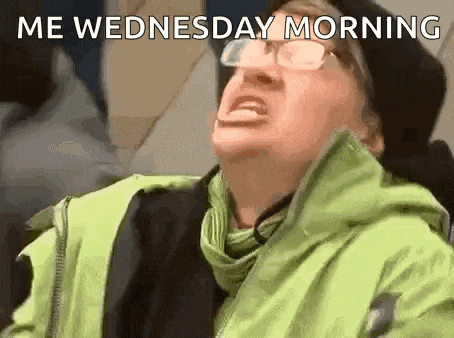 a woman wearing glasses and a green jacket is making a funny face and says `` me wednesday morning '' .