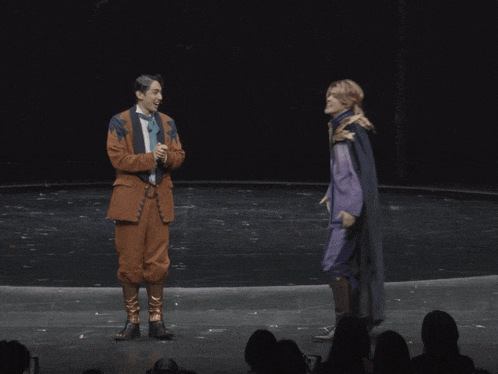 a man in a suit is being touched by another person