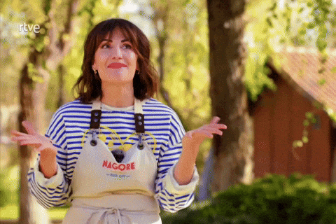 a woman wearing a striped shirt and an apron that says nagore on it