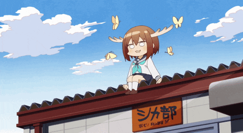 a girl with antlers sits on the roof of a building with chinese writing
