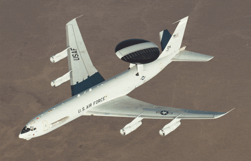 a u.s. air force plane is flying over a desert