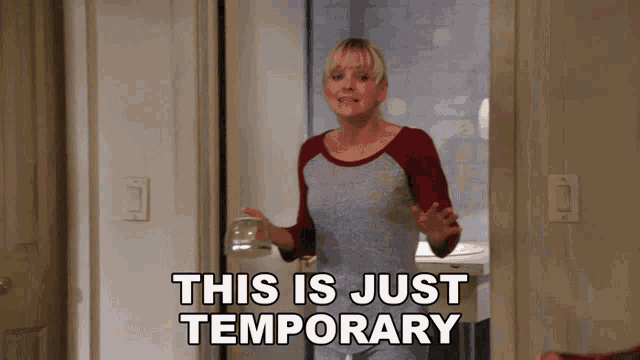a woman standing in a doorway with the words " this is just temporary " written on it