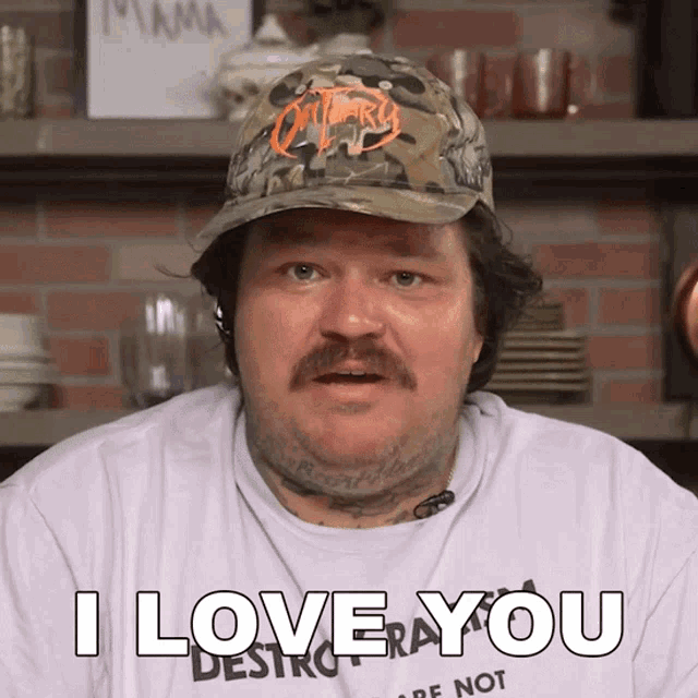 a man wearing a hat and a t-shirt that says i love you