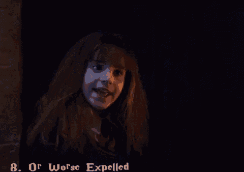 harry potter and ron weasley standing next to each other in a dark room