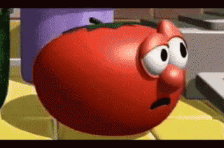 a cartoon tomato with a big nose and eyes