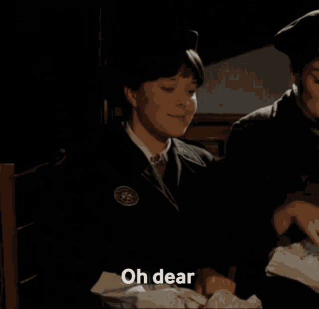 a woman in a uniform is sitting next to a man and says do i hear someone stomping off ?
