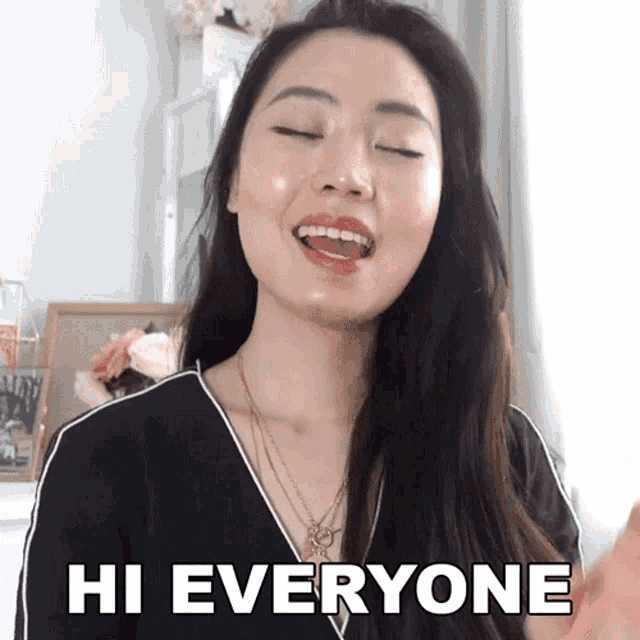 a woman says hi everyone with her tongue hanging out
