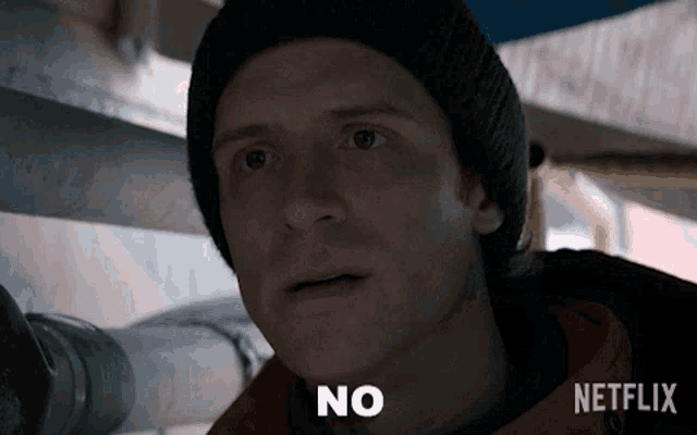 a man wearing a hat and a jacket says no
