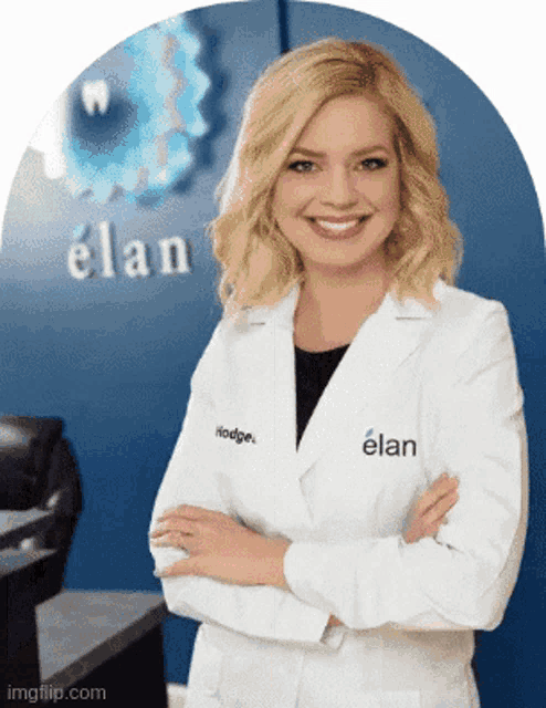 a woman in a lab coat with elan written on the back