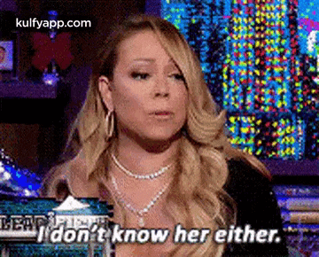 a woman is talking on a television show and saying `` i don t know her either . ''