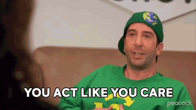 a man wearing a green hat and a green sweater says you act like you care