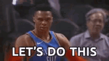 a basketball player is saying let 's do this with his arms outstretched