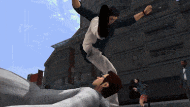 a man kicks another man in the face in front of a building with a sign that says ' a ' on it