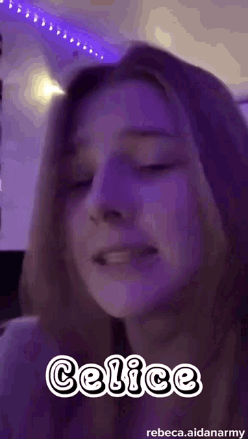 a close up of a woman 's face with purple lights behind her and the word celice on it .