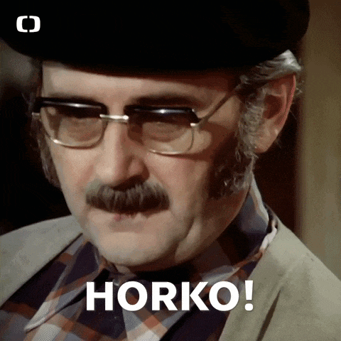 a man with glasses and a mustache says horko on his face