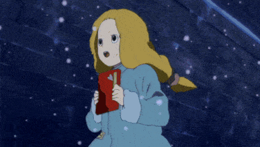 a girl in a blue dress stands in front of a brick wall in the snow